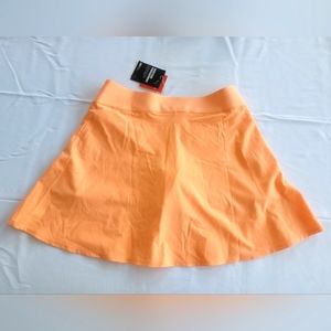 Puma Womens PWR SHAPE Golf Skort soft orange new with tags size Large